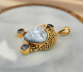 18K Yellow Gold Sajen Bali Goddess Carved Mother of Pearl, Sapphire Pendant